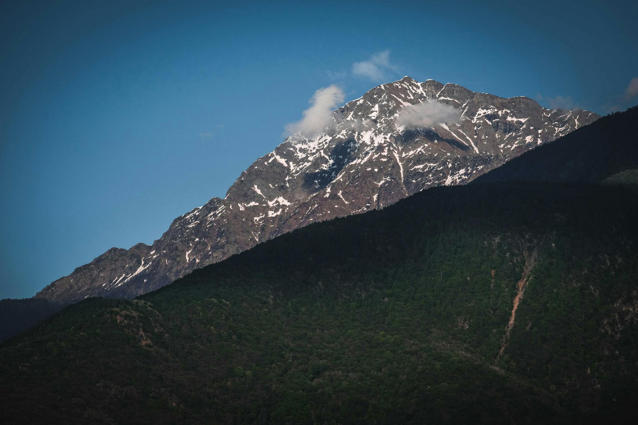 Picturesque mountain ridge against blue sky